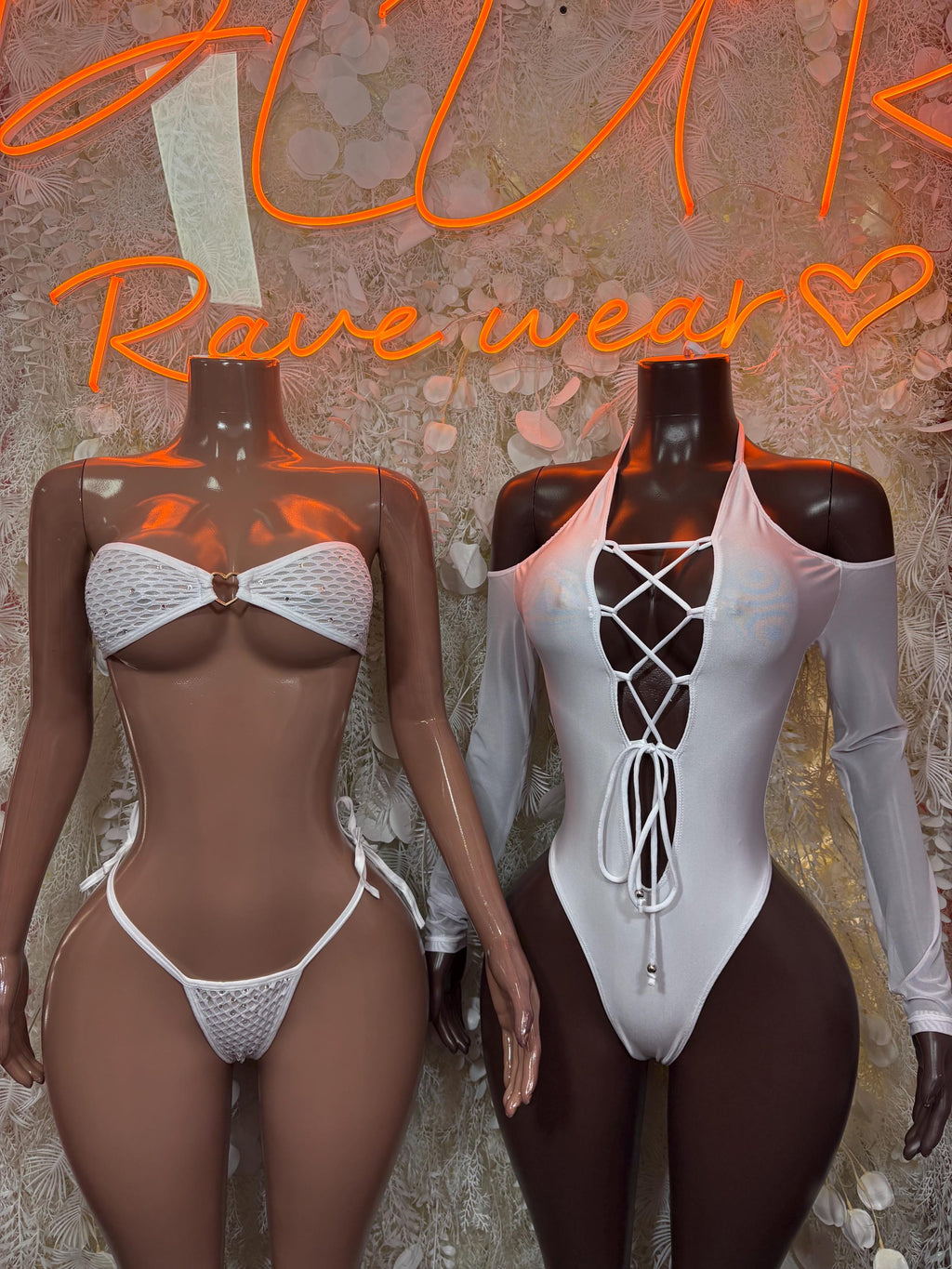 White lace-up bodysuit with crisscross front ties and thong cut, long sleeves