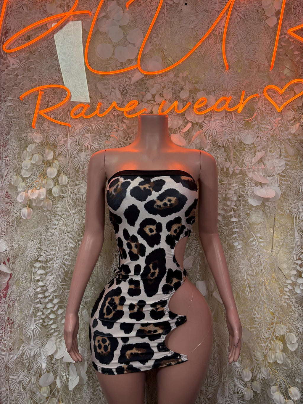 Leopard print mini dress with black mesh sleeves and scoop neckline