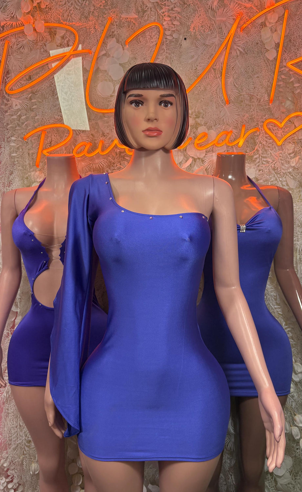 Purple halter mini dress with scoop neckline, ruching at front, and fitted hem