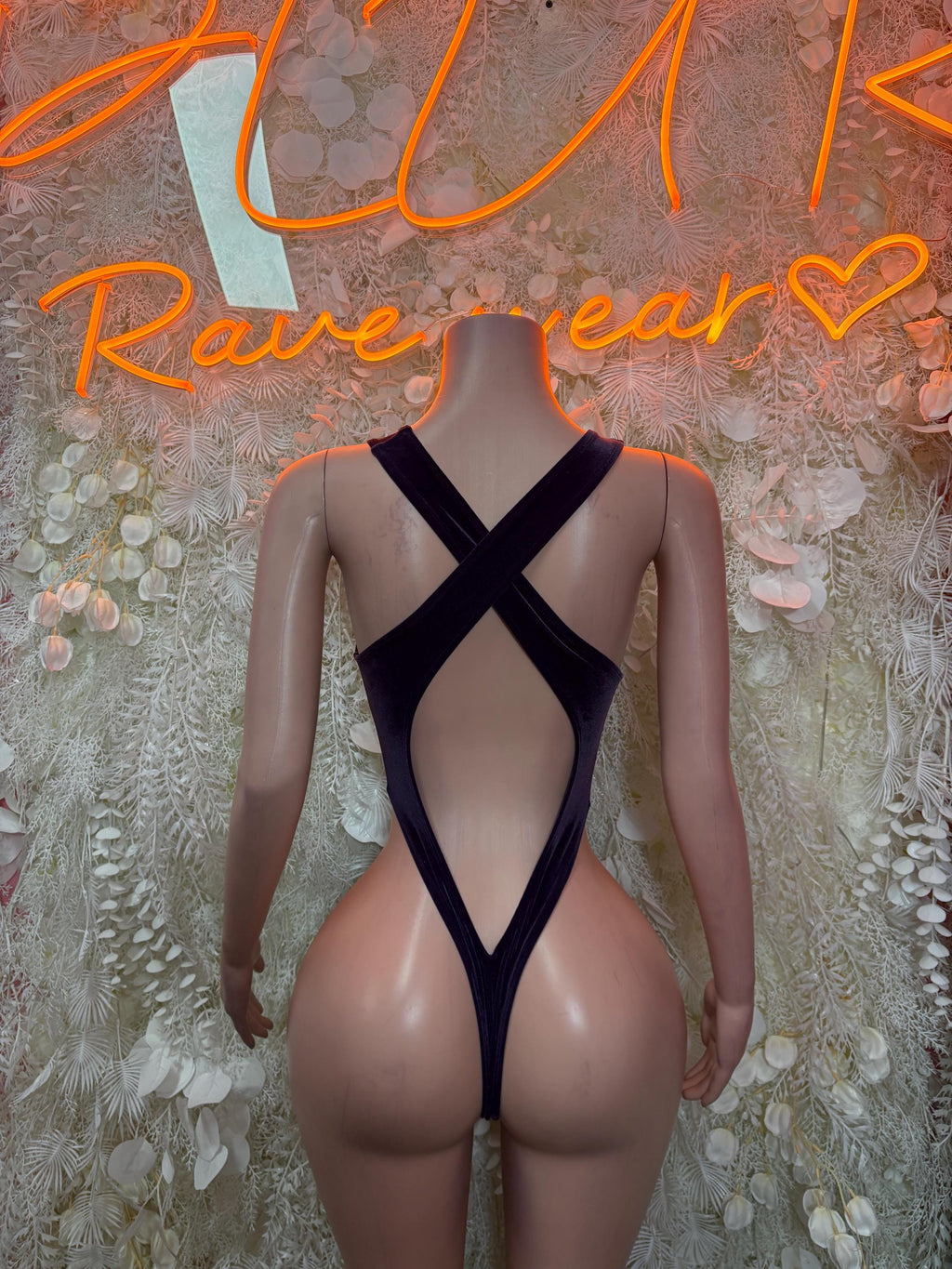 Black cutout bodysuit with crisscross back straps and deep V front