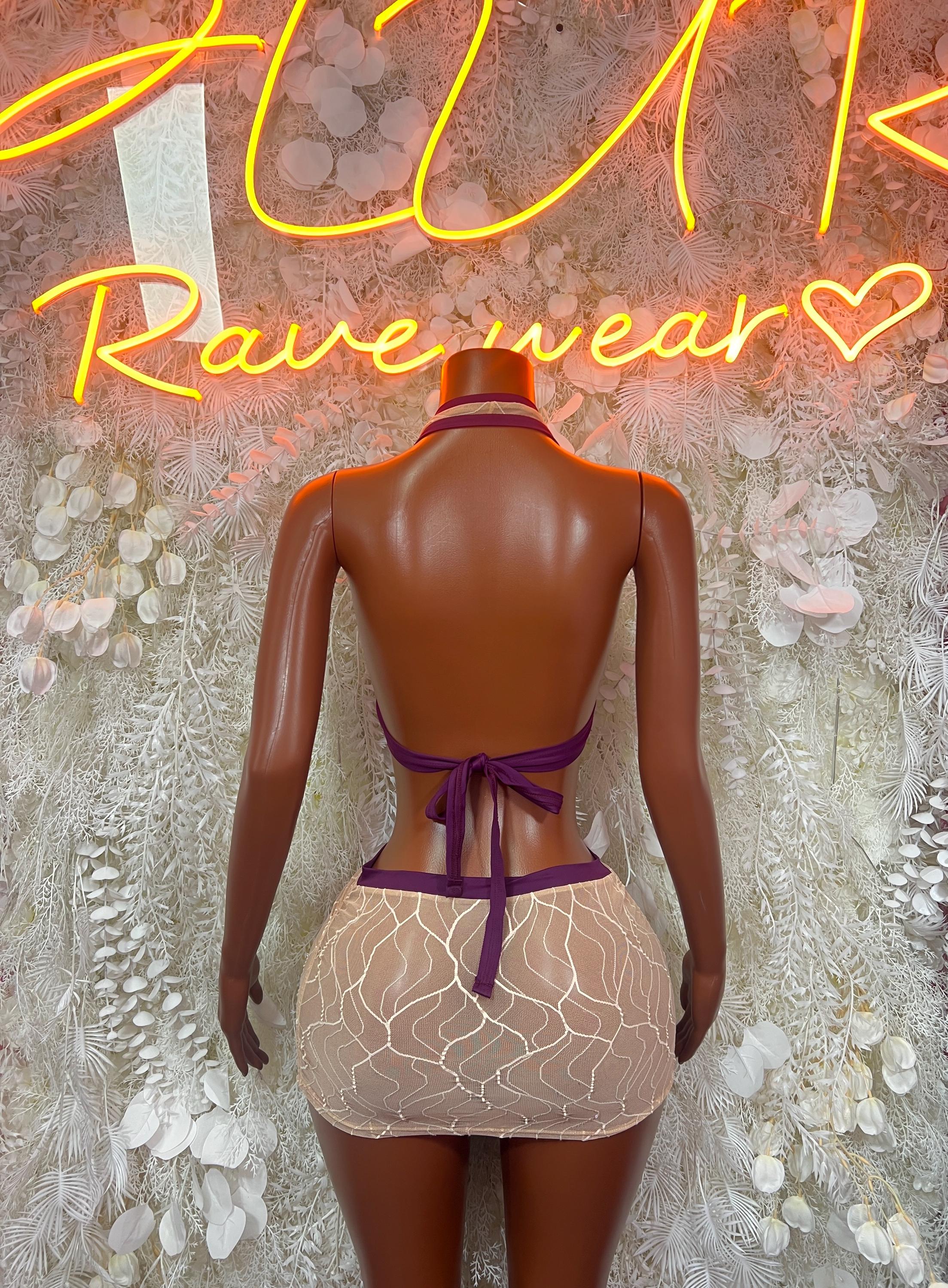 Two-piece skirt set, back view: purple halter bra with tie straps and beige mini skirt