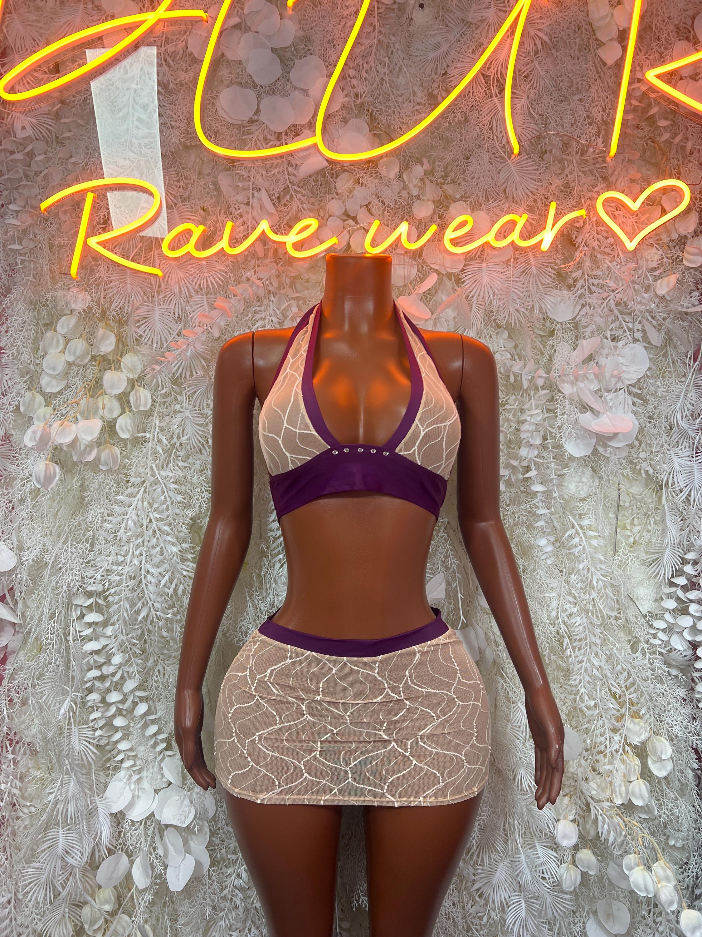 Two-piece skirt set with purple bra and beige mini skirt over nude web mesh
