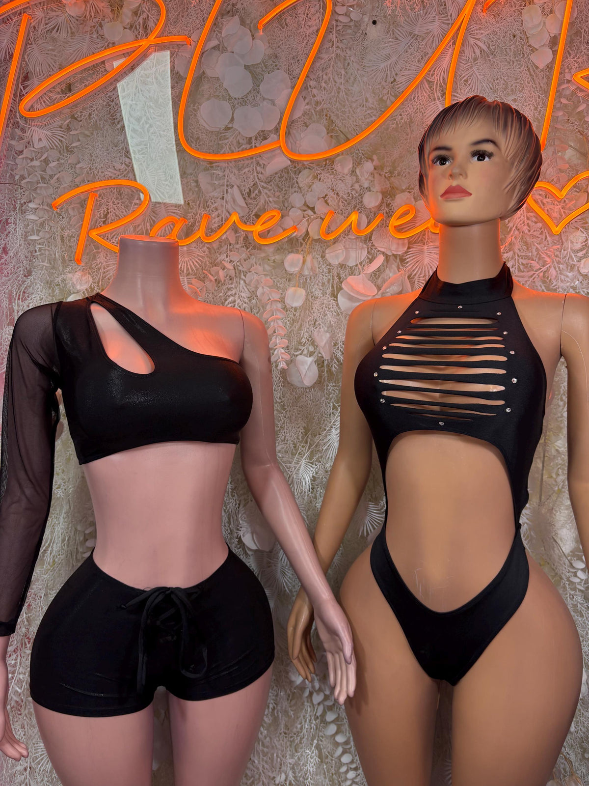 Black mesh one-shoulder crop top and drawstring shorts; cutout bodysuit on second model