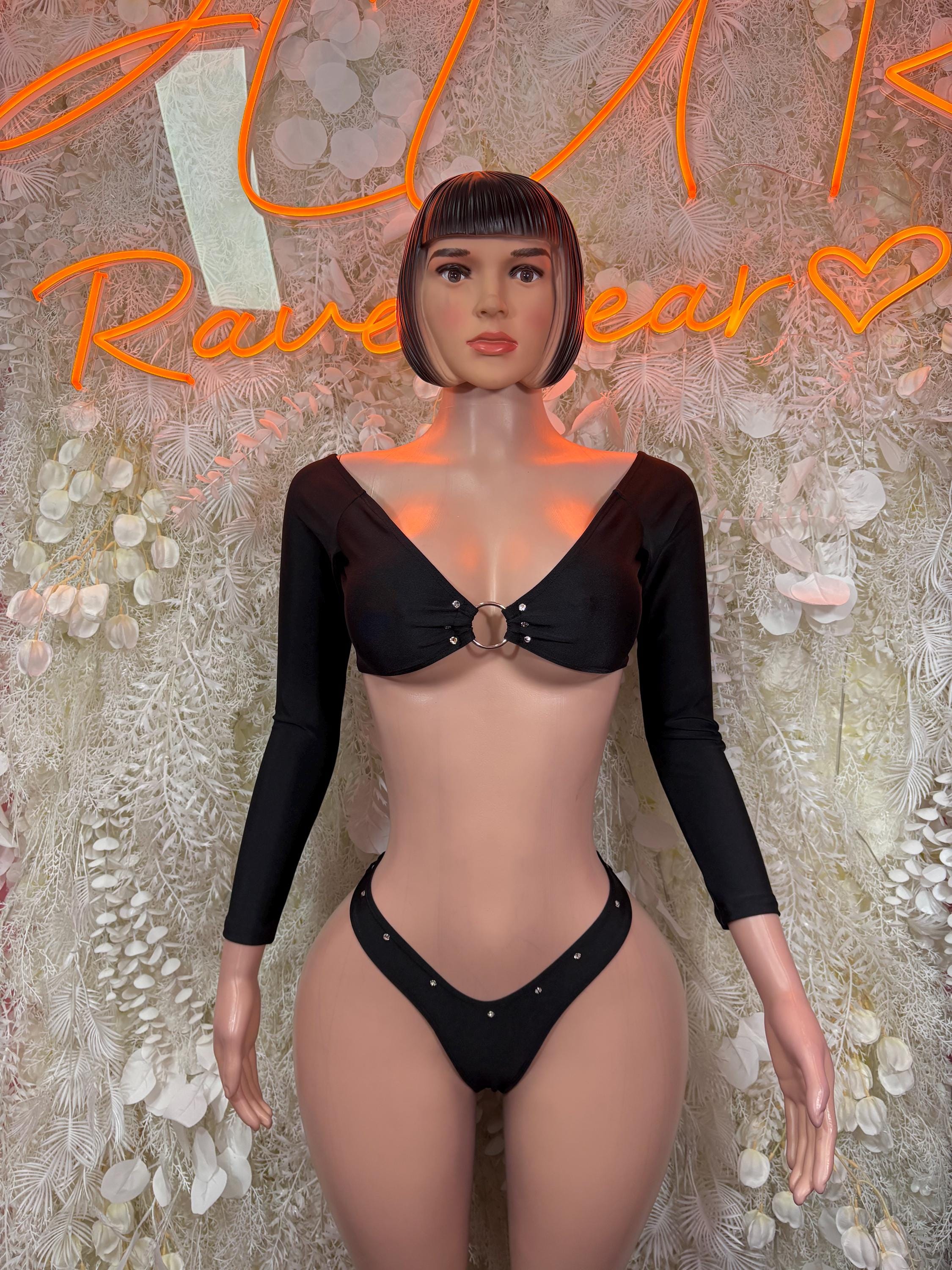Black two-piece rave outfit: long-sleeve black crop top and V-string thong bottoms