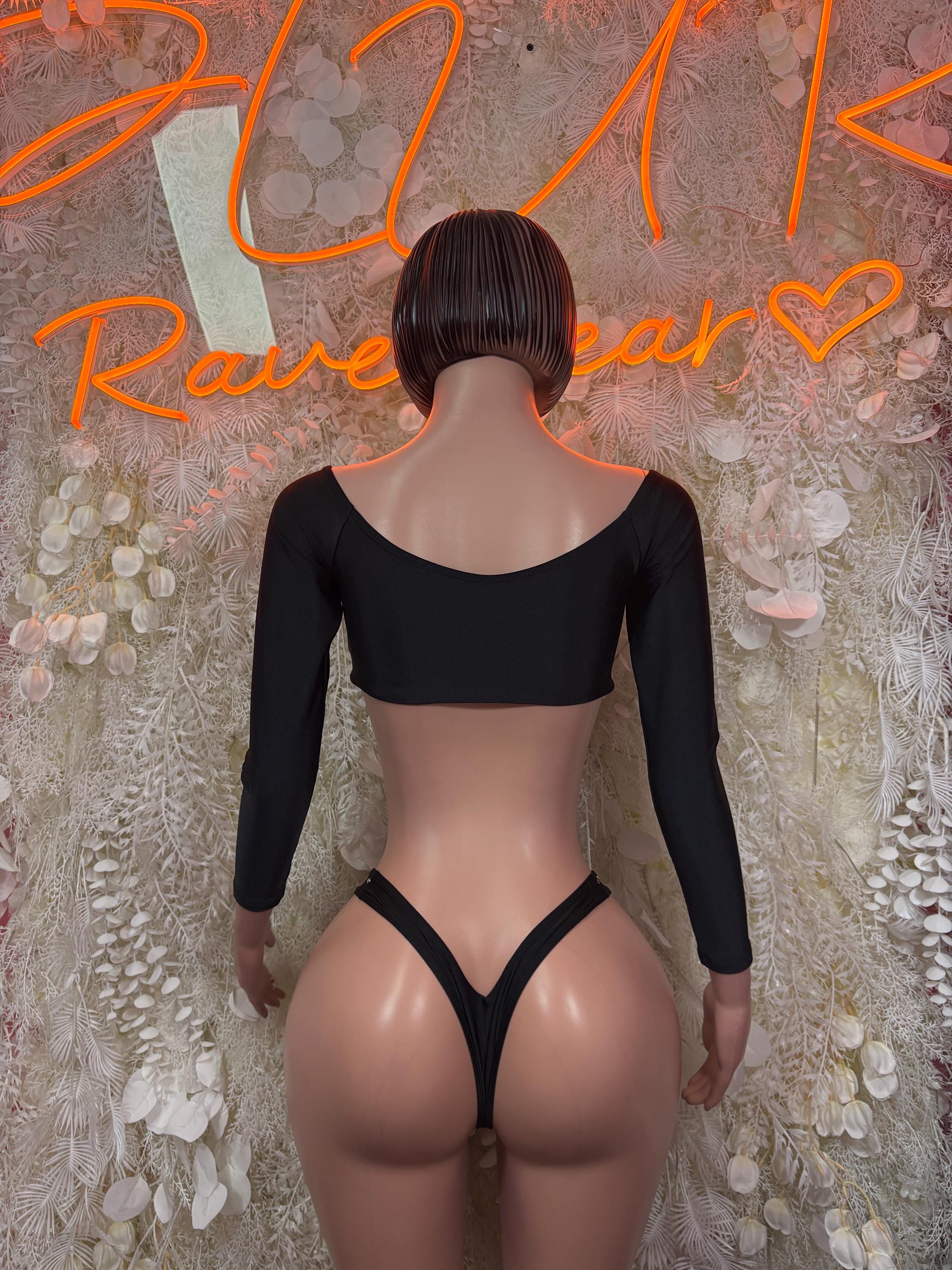 Black two-piece rave outfit: long-sleeve crop top and V-string thong bottoms, rear view