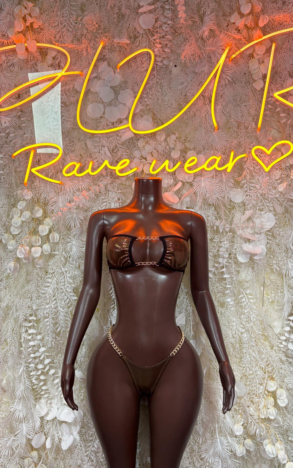 Dark metallic chain bikini with underwire bra and high-leg thong bottoms on mannequin.