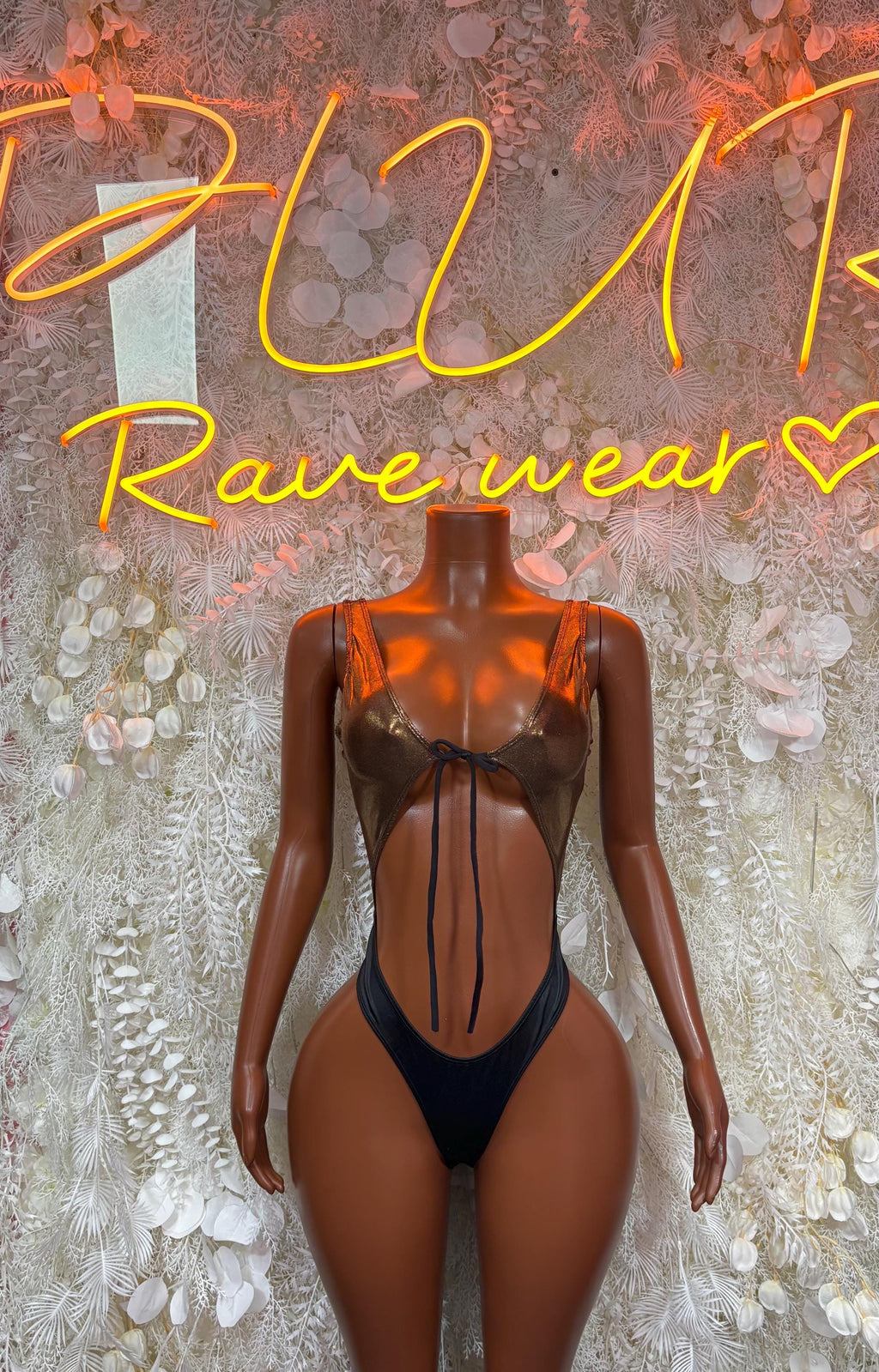 Dark metallic one-piece bodysuit with V neckline, sheer side panels, thong cut