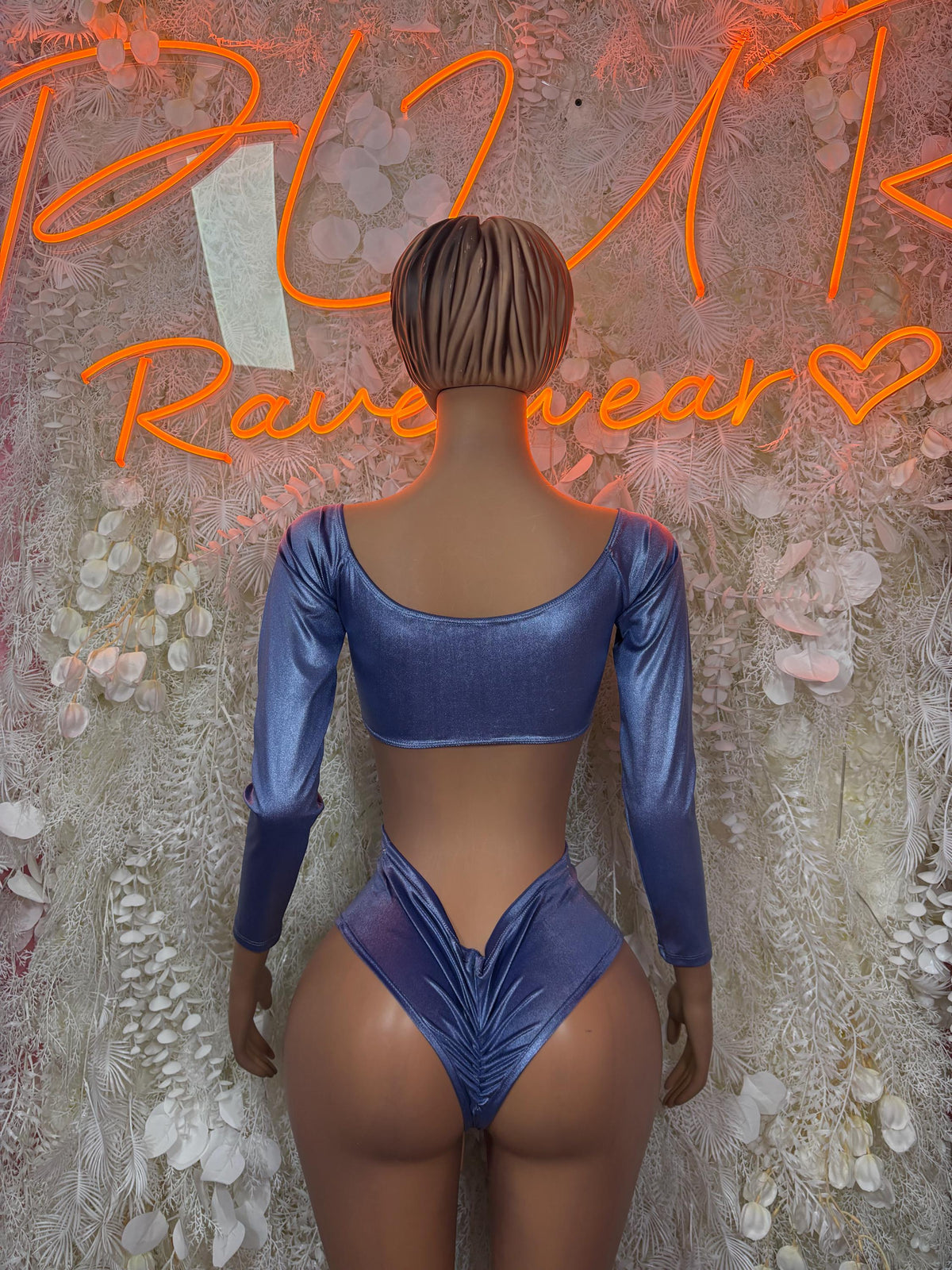 Back view of blue metallic two-piece bodysuit with long sleeves and high-cut bottoms
