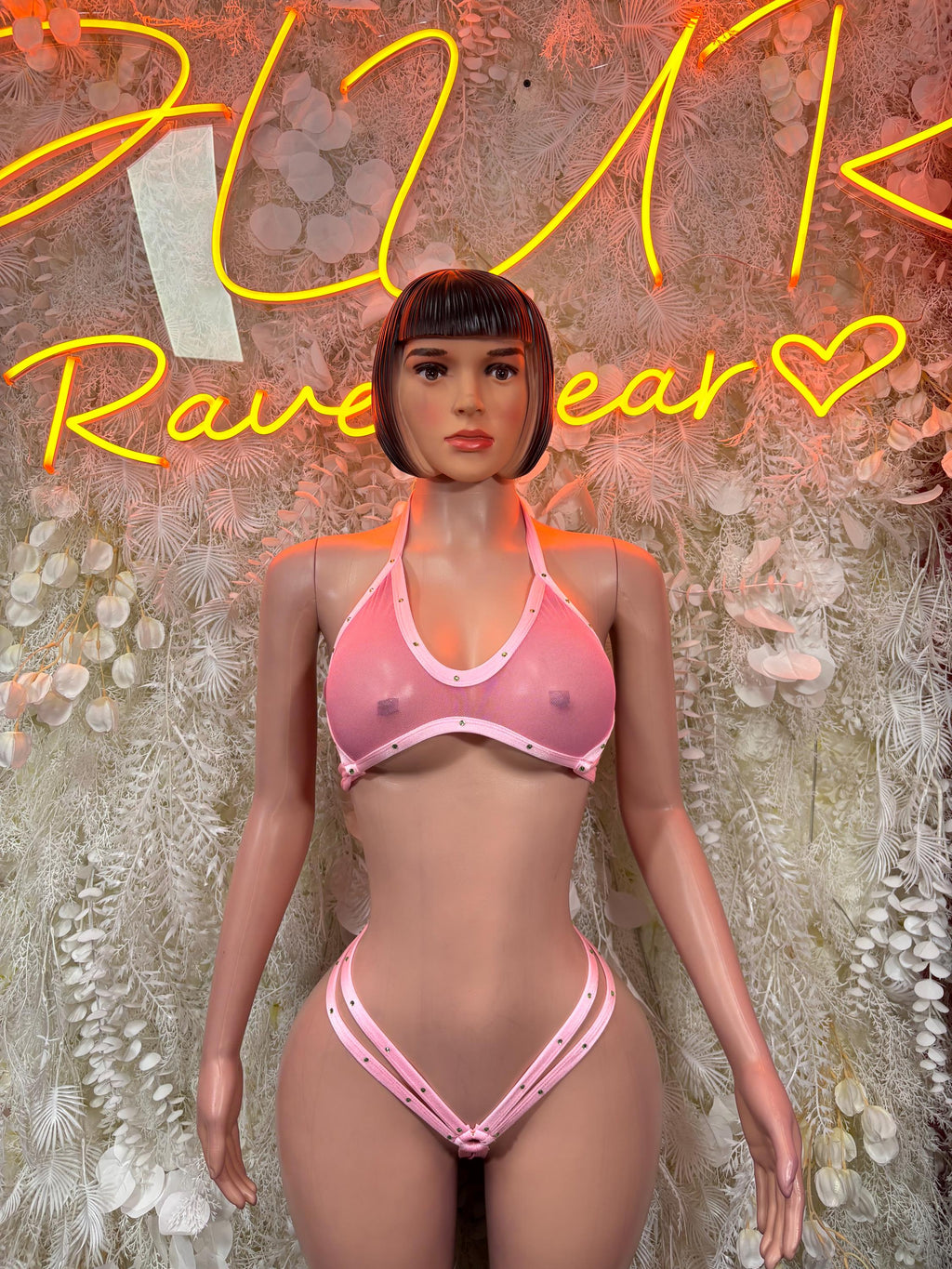 Baby pink halter bralette with mesh cutouts and high-leg bikini bottoms