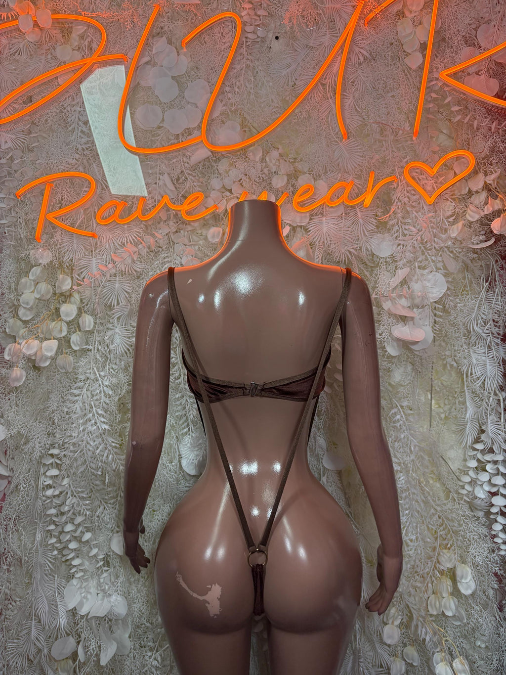 Brown velvet slingshot one-piece rave outfit with open back and crisscross strap detail