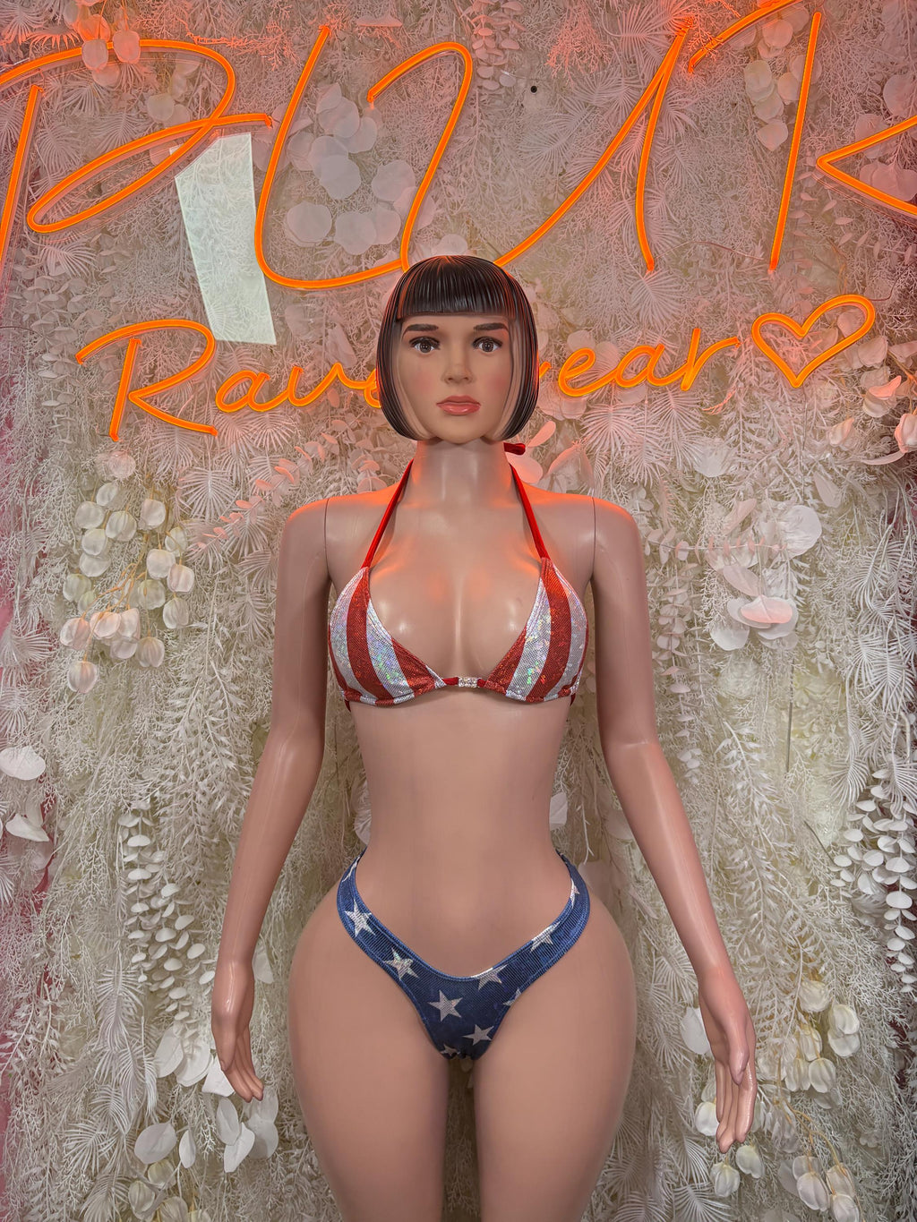 Two-piece bikini with red, white, blue striped triangle top and star low-rise bottoms