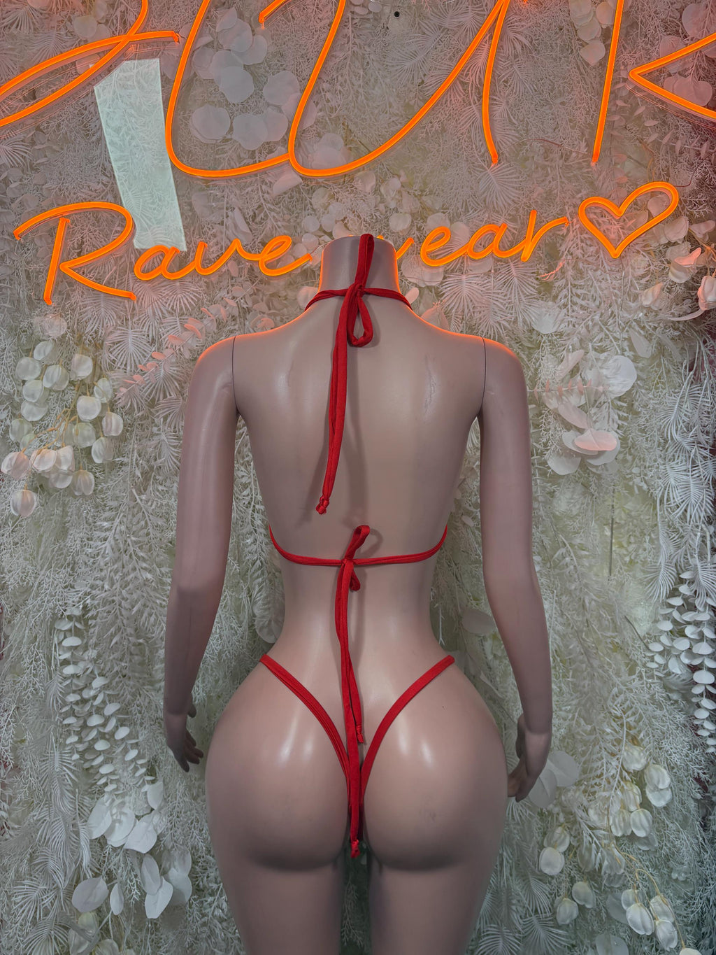 Red backless bikini with tie halter straps and bow; string bottom