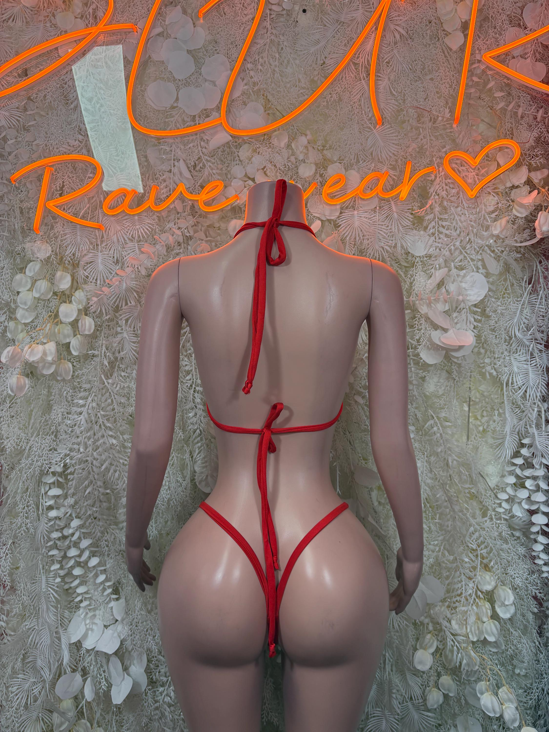 Red backless bikini with tie halter straps and bow; string bottom