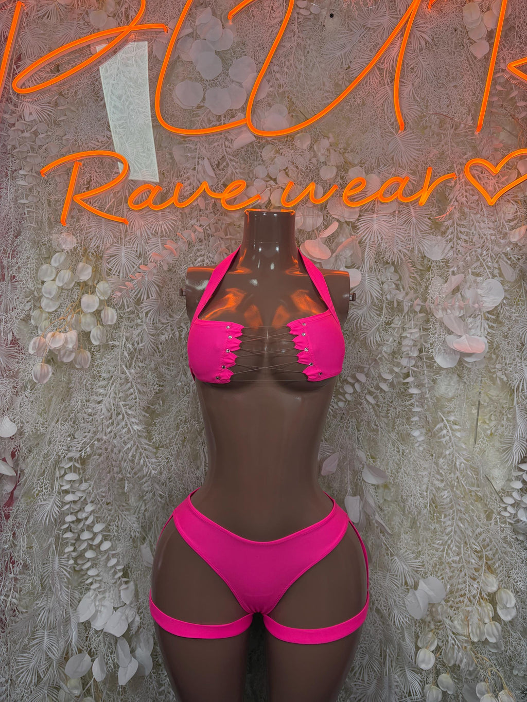 Hot pink two-piece rave bikini set with ruffled triangle top and high-cut bottoms