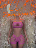 Pink satin bandeau top and high-waist shorts set with cutout straps, front view