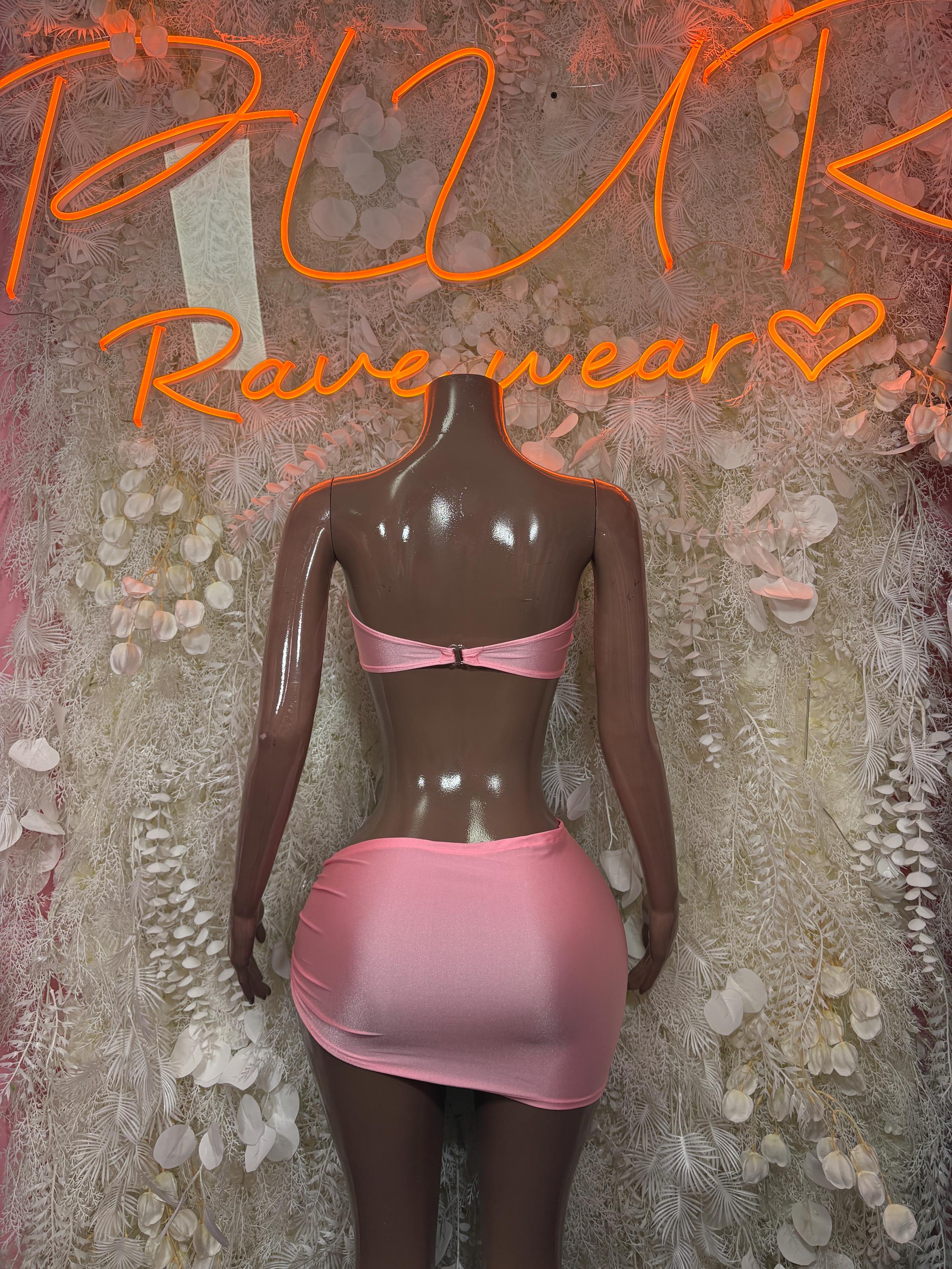 Pink two-piece skirt set with ruched bandeau top and matching mini skirt