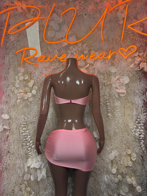 Pink two-piece skirt set with ruched bandeau top and matching mini skirt