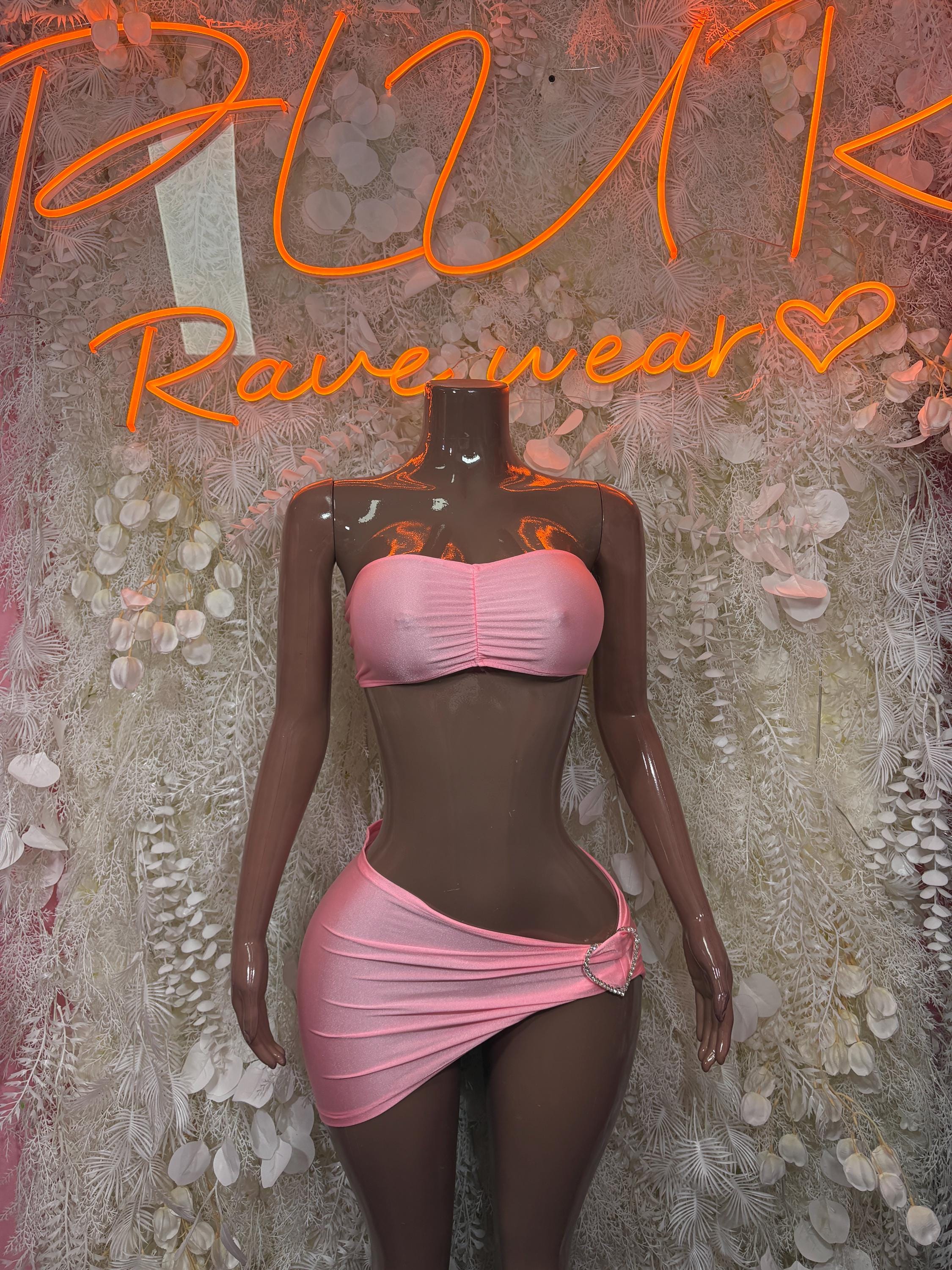 Pink two-piece skirt set with ruched bandeau top and tied mini skirt