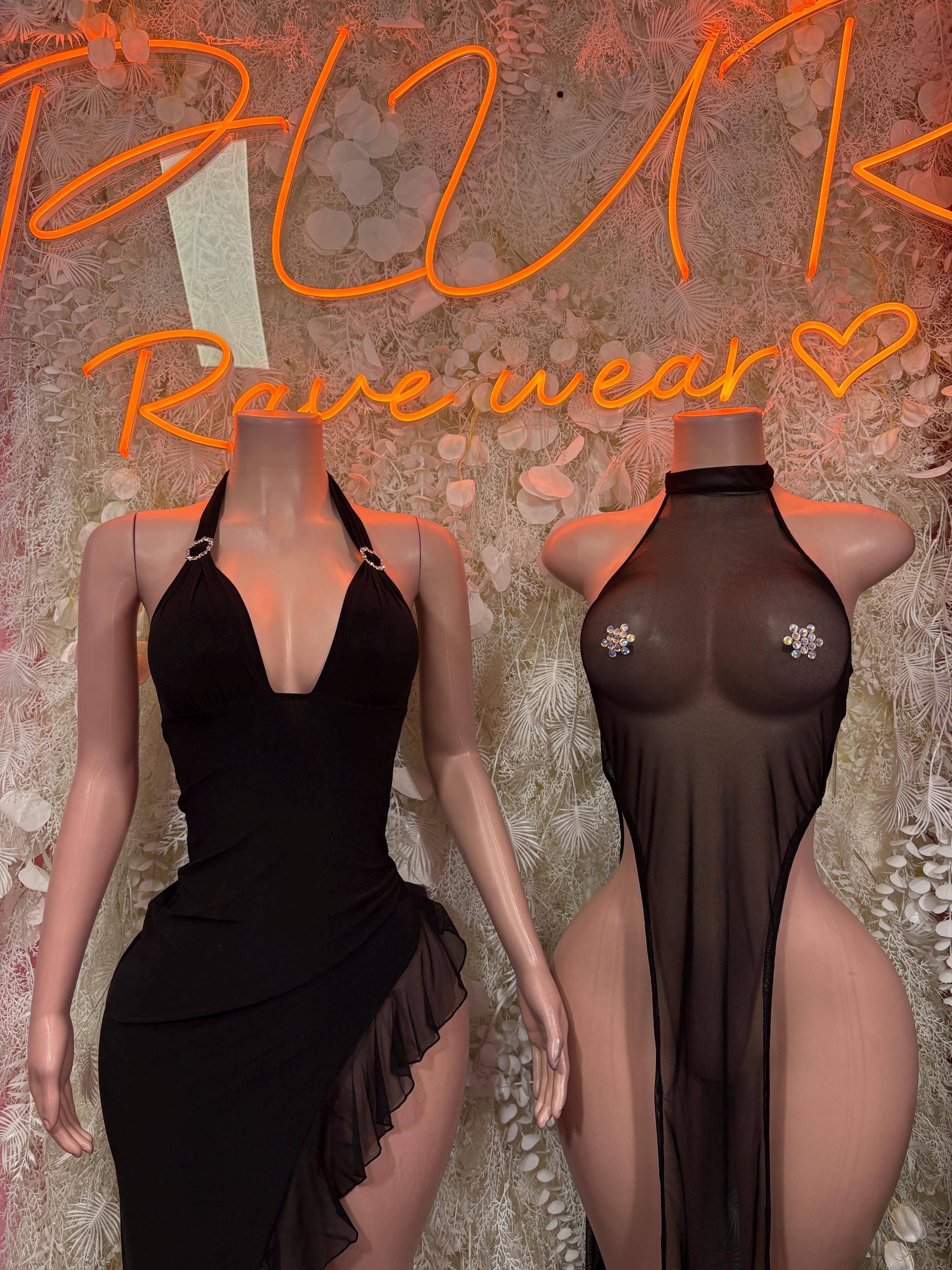 Black sleeveless halter gown with open back and mesh-like bodice panel