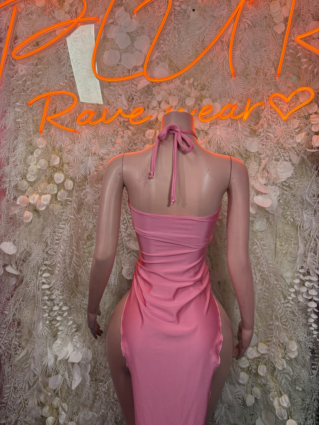 Pink open-back halter cutout gown with ruched waist