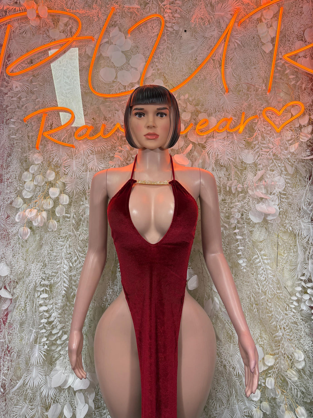 Burgundy velvet halter gown with deep V neckline and high-cut leg openings