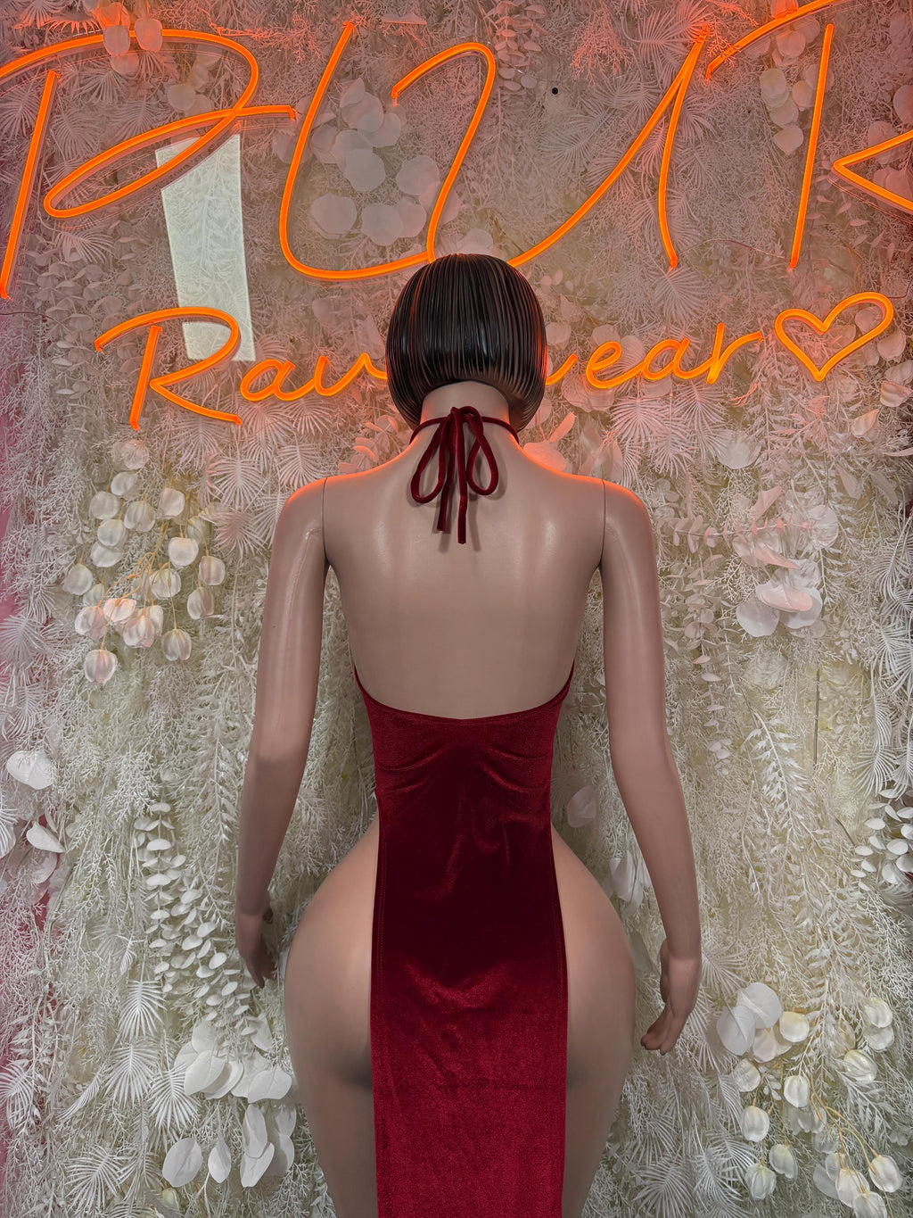 Burgundy velvet halter gown, open back with halter ties and high-cut sides