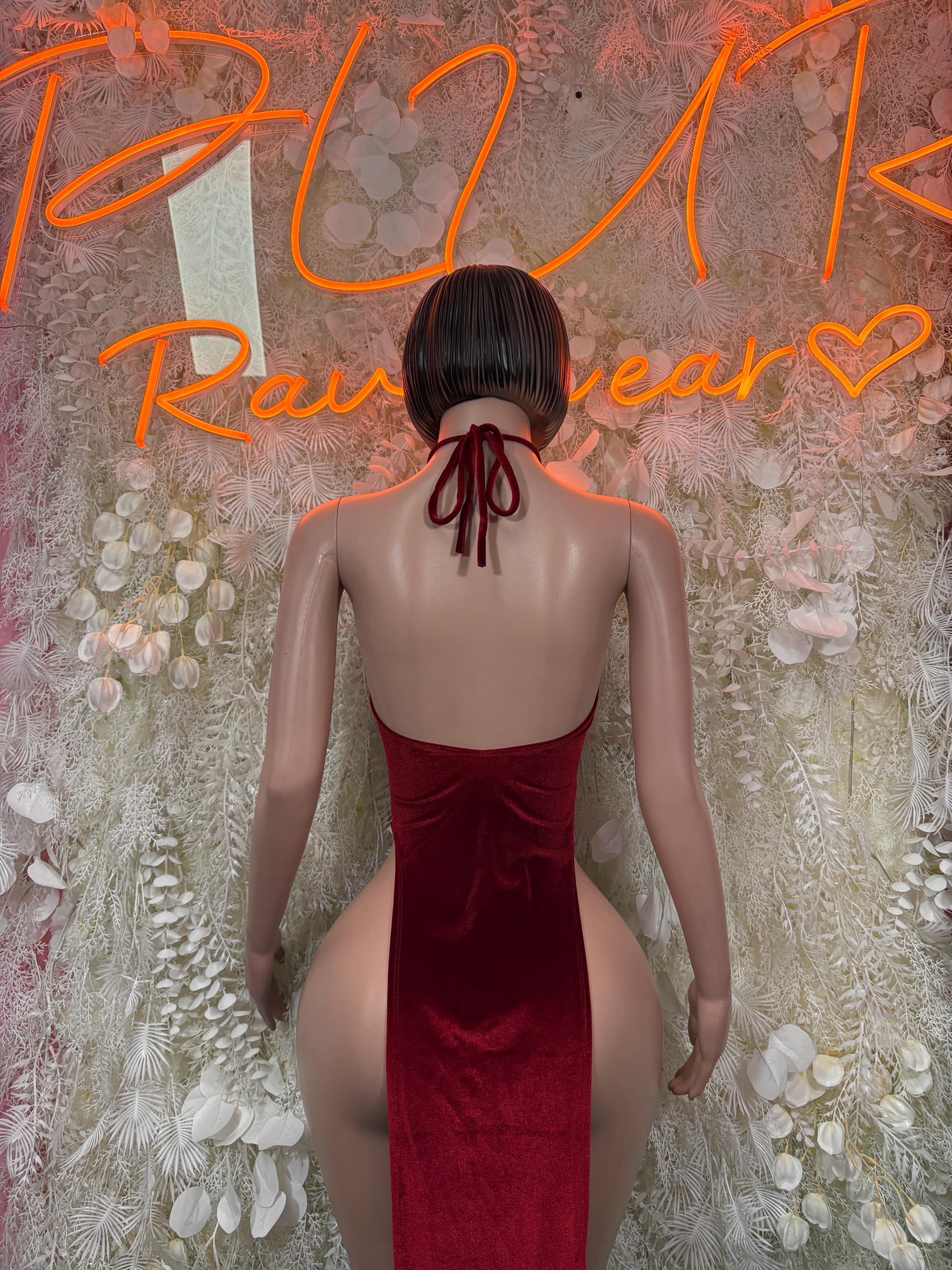 Burgundy velvet halter gown, open back with halter ties and high-cut sides
