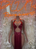 Burgundy halter satin gown with deep V neckline and waist cutout