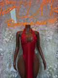 Red halter neck rhinestone gown with deep V front and open back