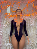 Purple velvet one-piece dancewear with long sleeves and button-front plunging neckline