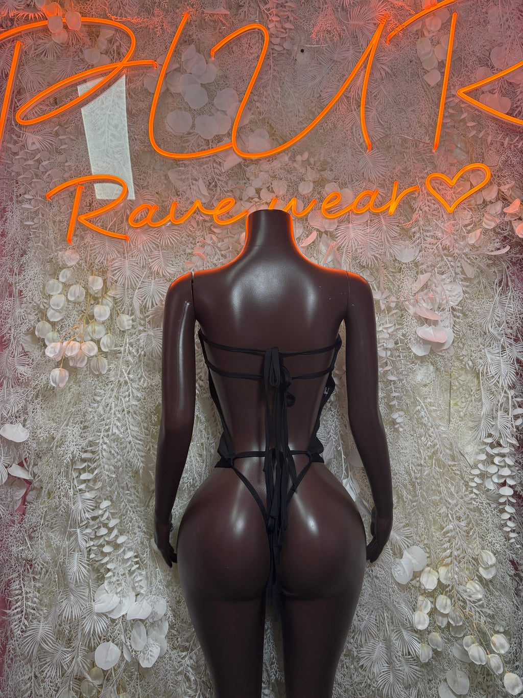 Black sheer bodysuit with open back and crisscross tie detail