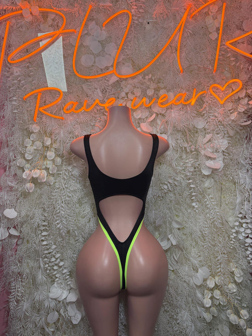 Black neon lace-up bodysuit with neon green edging and deep cutout, backless look