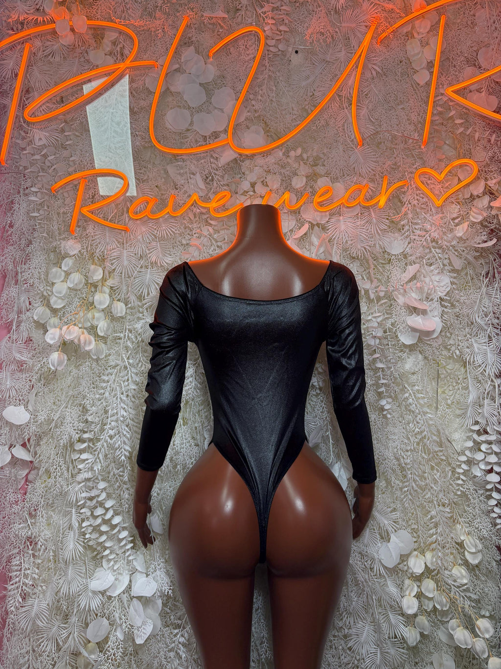 Black long-sleeve bodysuit with square neckline and seamless high-cut legs
