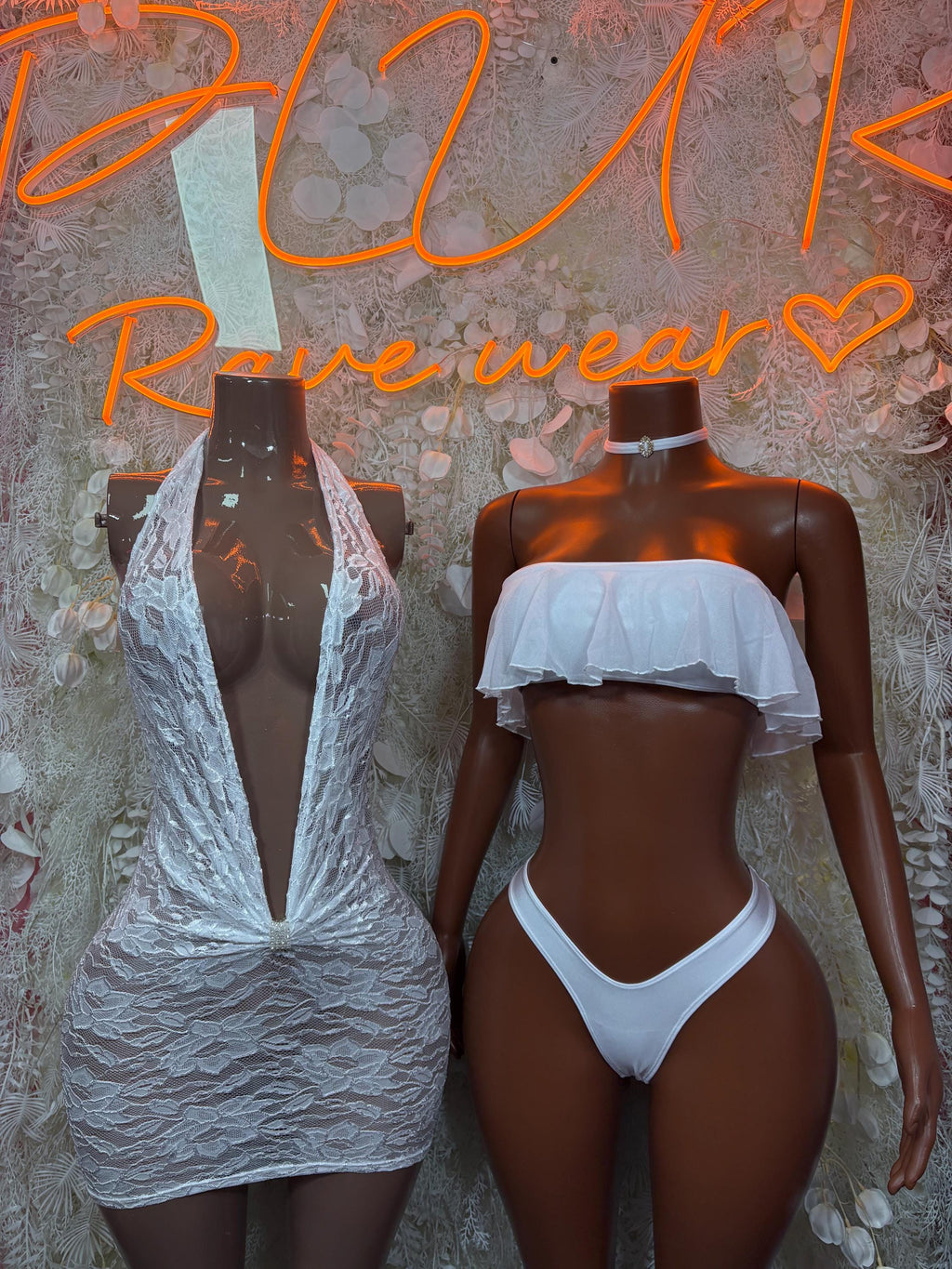 White lace mini dress and matching white lingerie set on mannequins