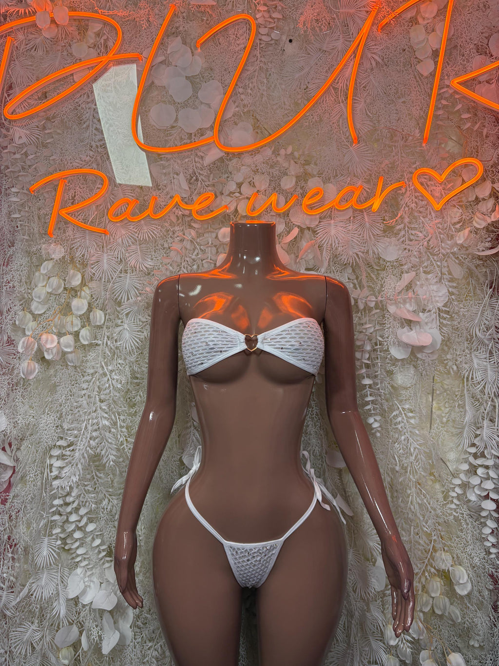 White two-piece bikini with textured triangle top and high-cut lace-up thong bottoms
