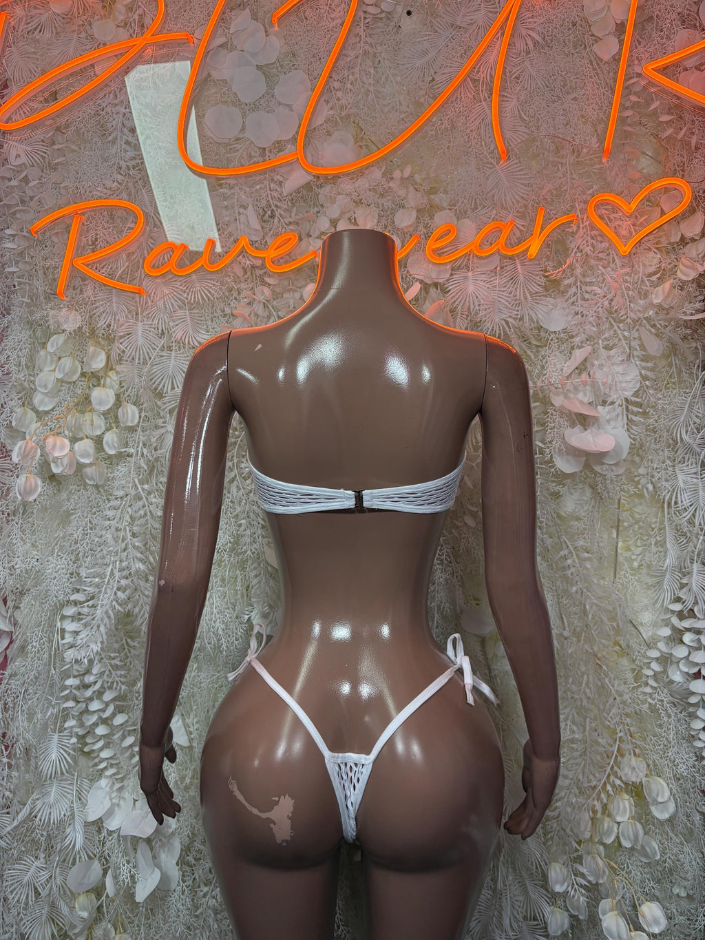 White two-piece bikini with lace-up halter triangle top and matching high-cut bottoms