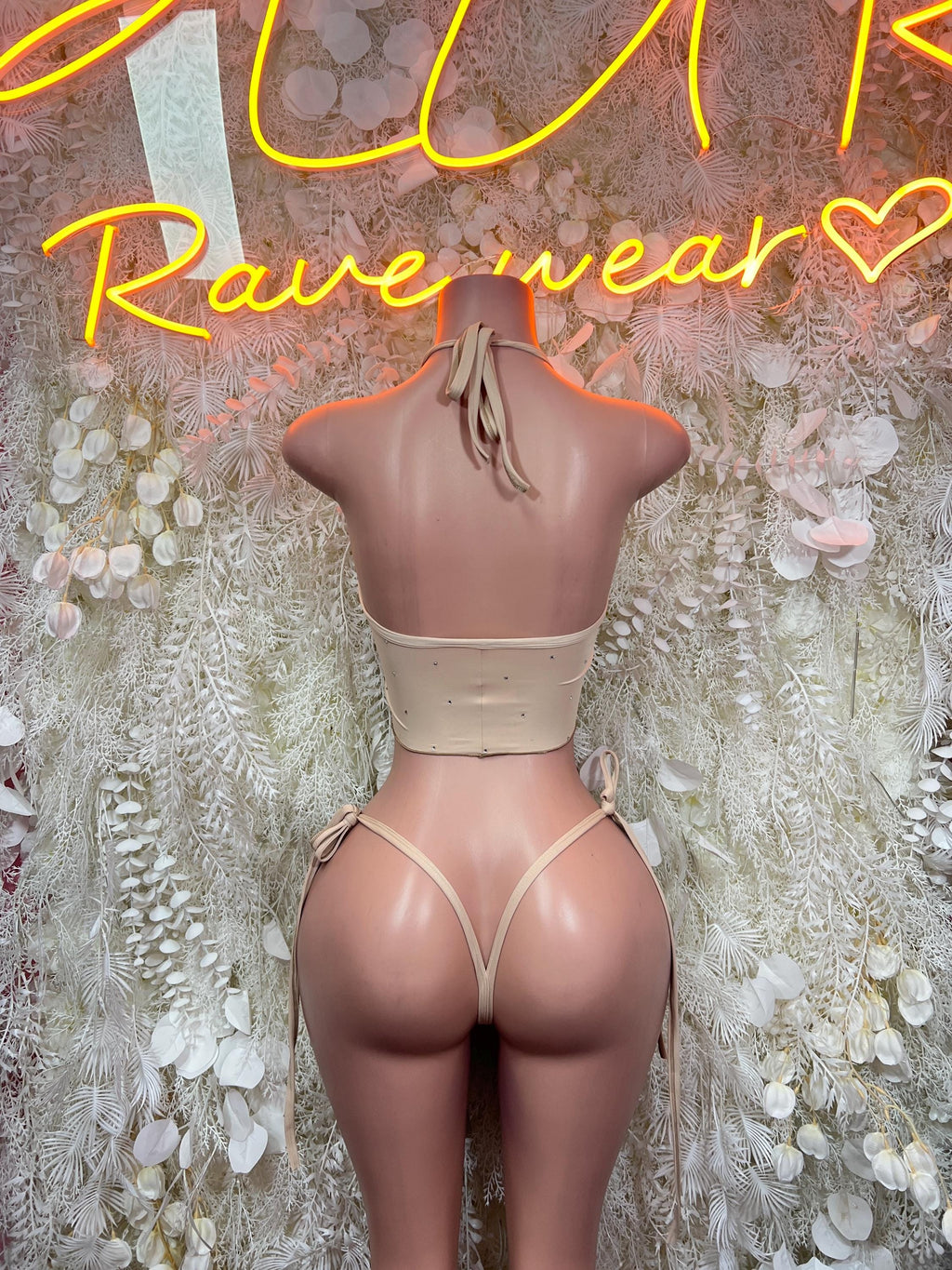 Beige halter crop bikini top and high-cut thong bottoms, back view, two-piece set