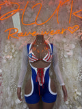 Rave bodysuit with star-and-stripe triangle print, blue shorts, long sheer sleeves