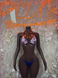 Two-piece bikini swimsuit with star-print triangle top and blue tie-bottom