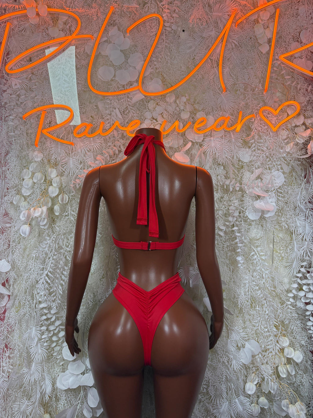 Red two-piece rave outfit back view: halter top with ribbon tie and high-cut bottoms