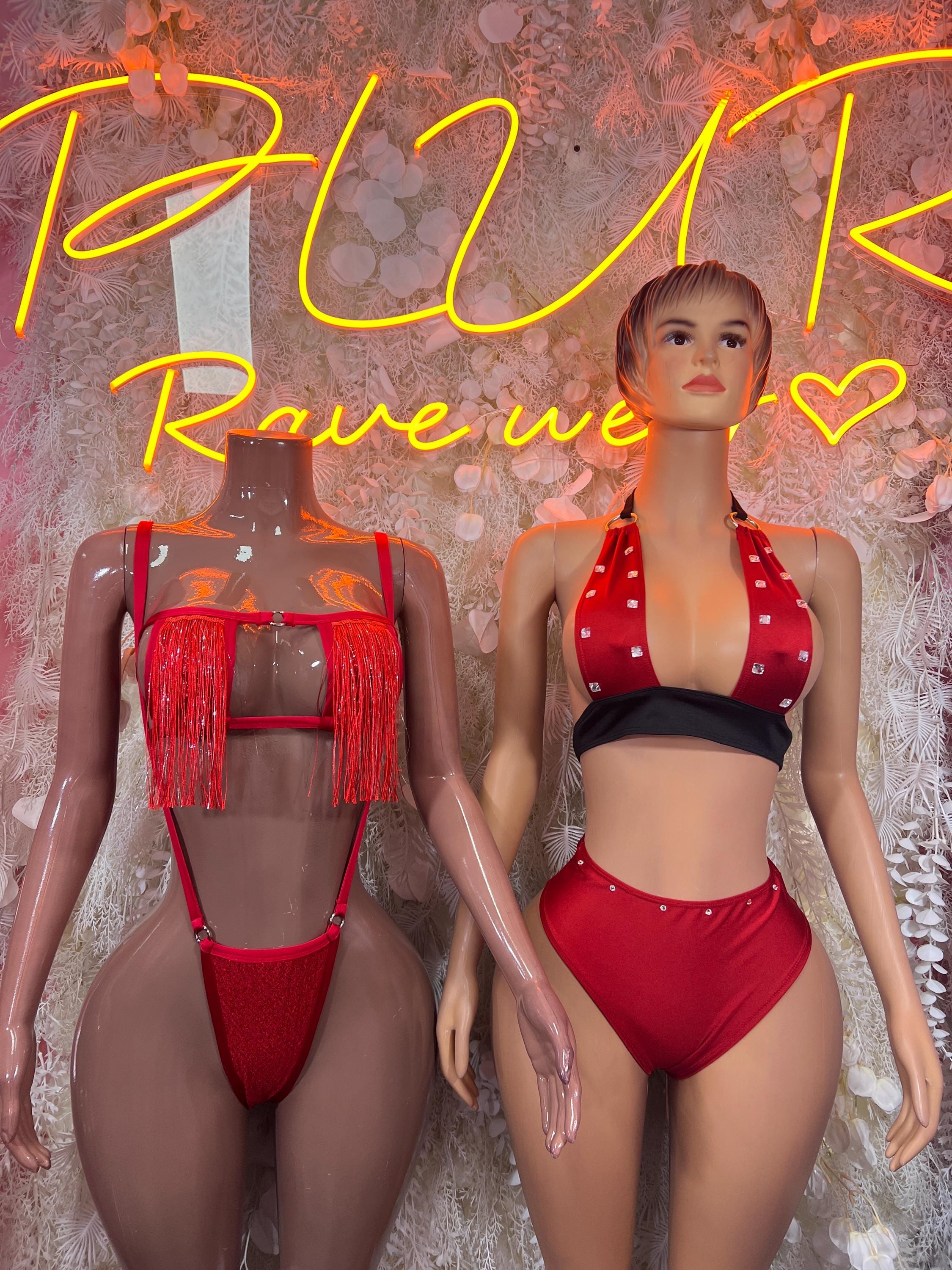 Red rave festival outfit with halter top, high-cut bottoms, and dangling fringe