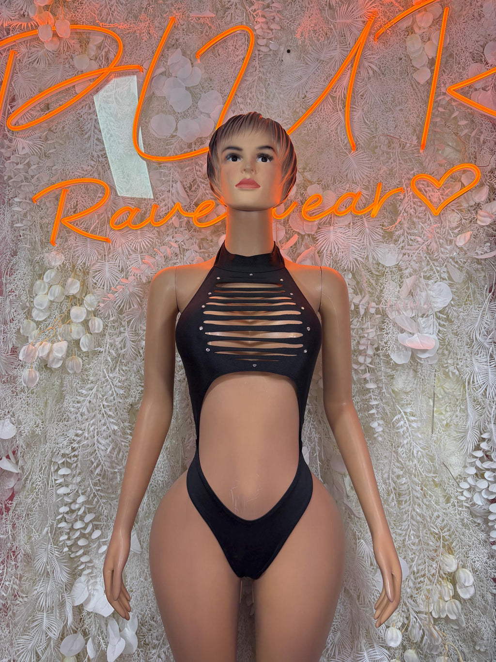 Black halter bodysuit with striped cutout front and high-leg fit