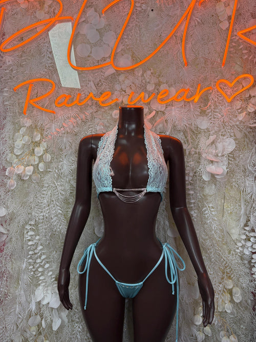 Light blue lace bikini lingerie with triangle cups, thin string ties, and matching briefs