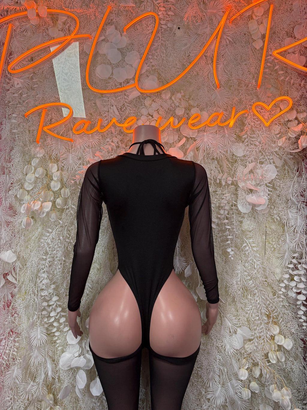 Black bodysuit with long sheer sleeves and high-cut back