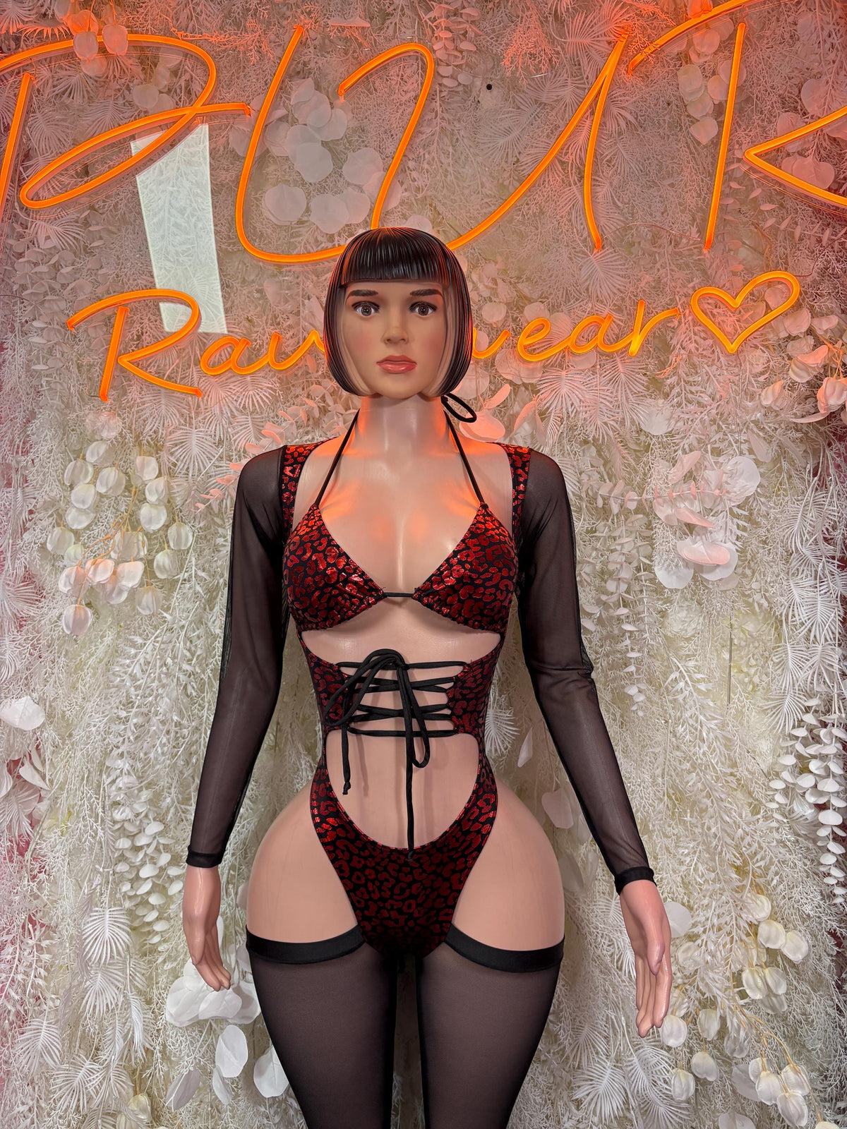 Red leopard-print bodysuit with crisscross lace-up front and black mesh long sleeves