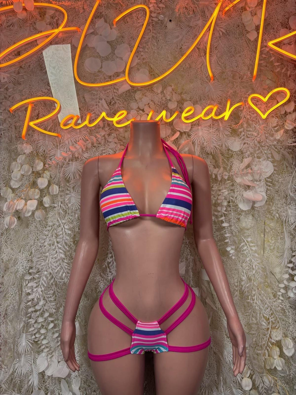 Rave bikini set with multicolor striped triangle top and strappy magenta bottoms