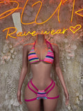 Rave bikini set with multicolor striped triangle top and strappy magenta bottoms