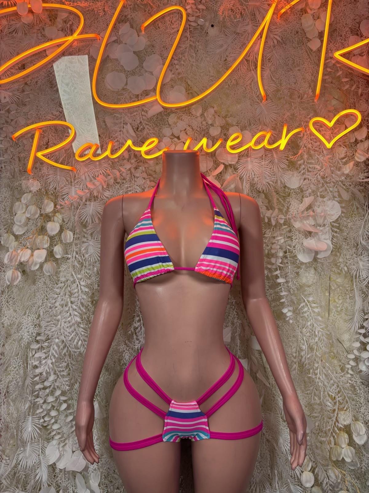 Rave bikini set with multicolor striped triangle top and strappy magenta bottoms