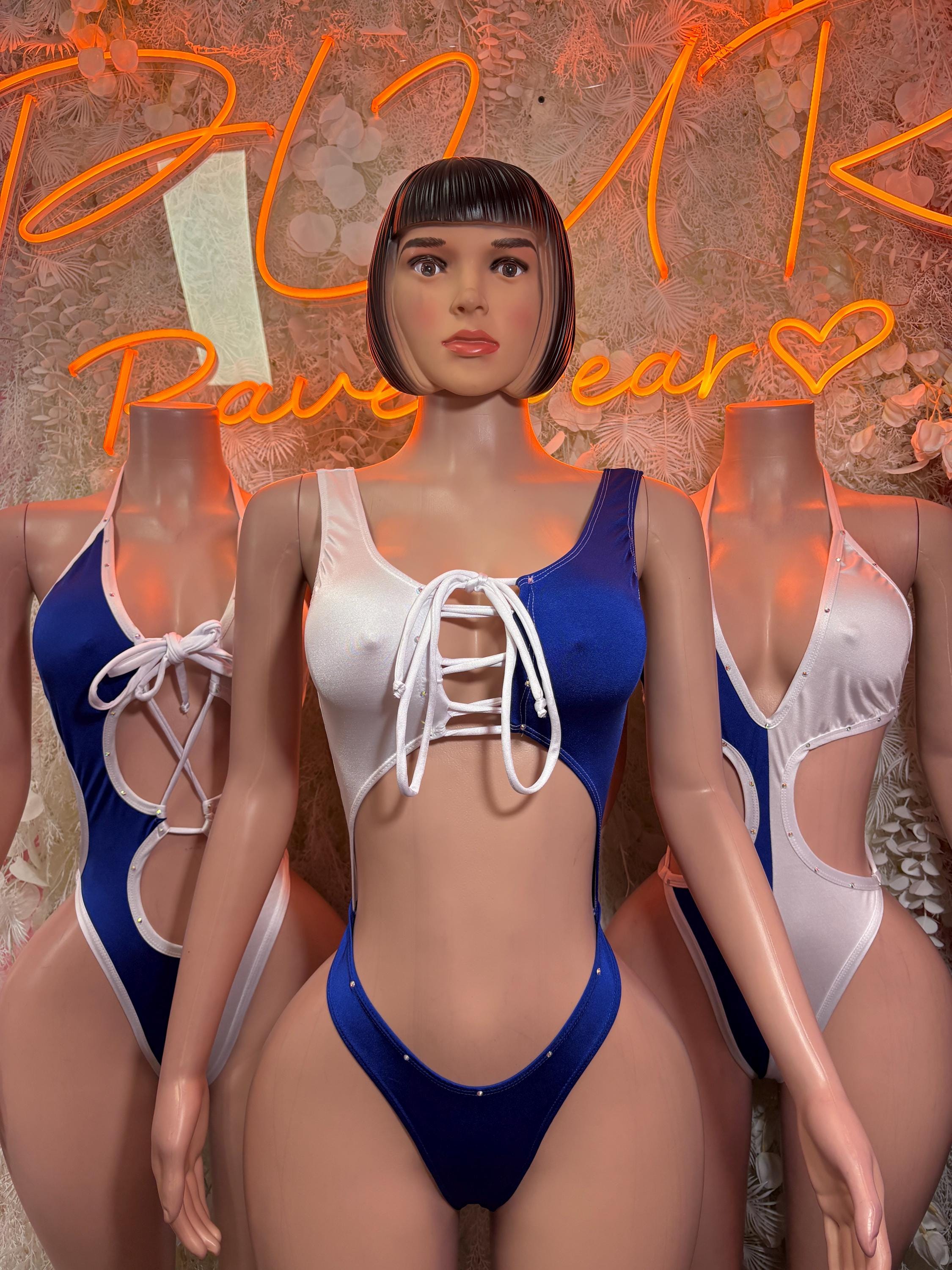 Women’s one-piece swimsuit with white lace-up front and blue underlay