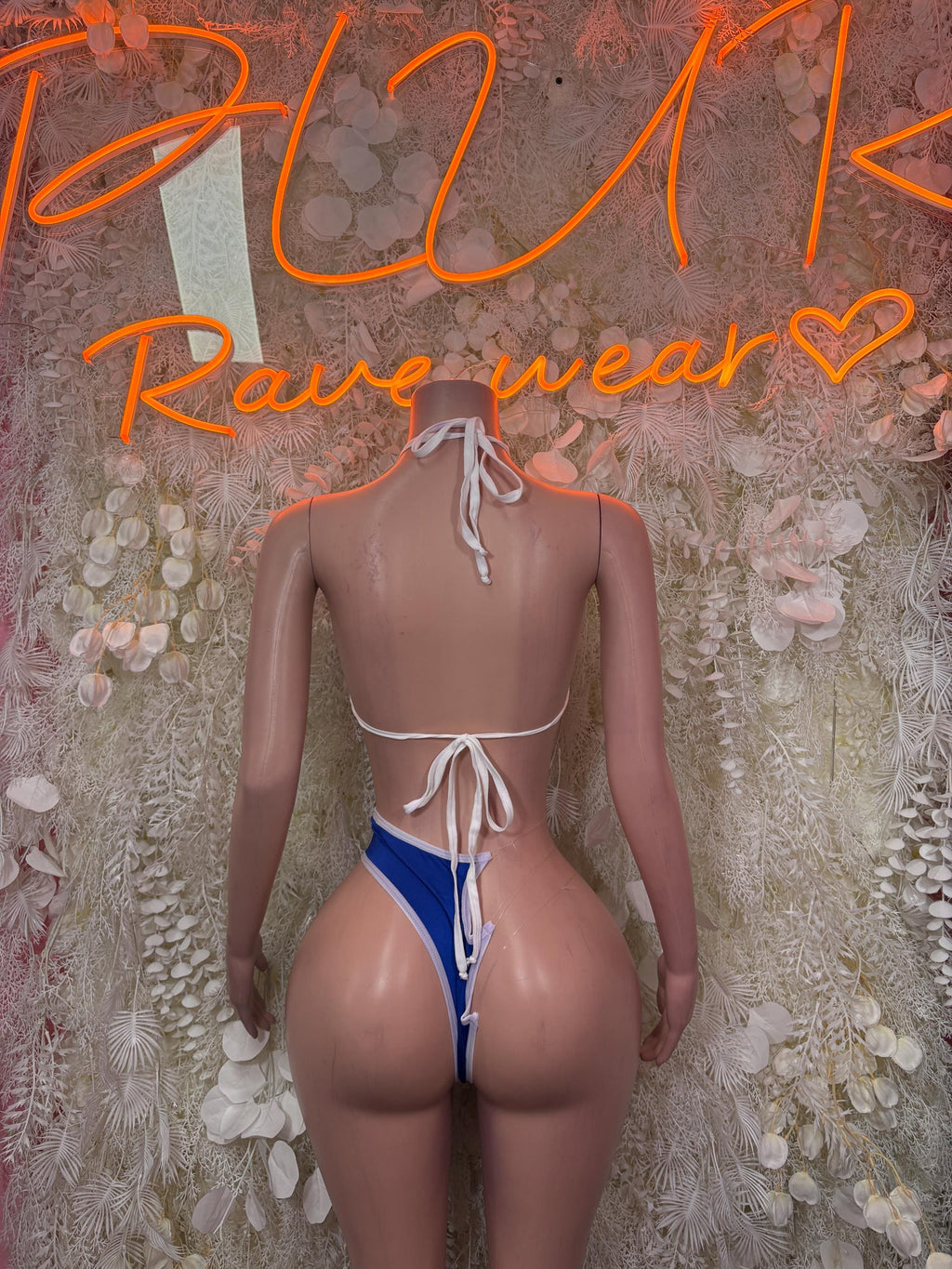 Two-piece bikini with white-and-blue scalloped panels, back string ties, high-leg bottom